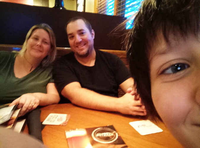 Athennia, Kevin, and Riley at Outback Steakhouse